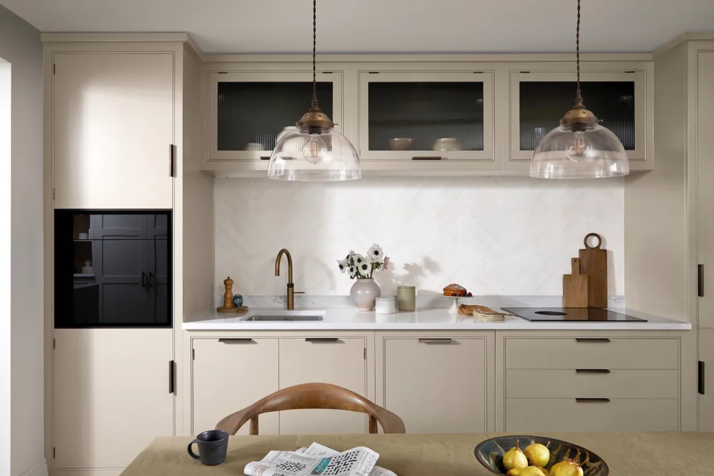 Modern neutral kitchen featuring Malone cabinetry painted in Burnet