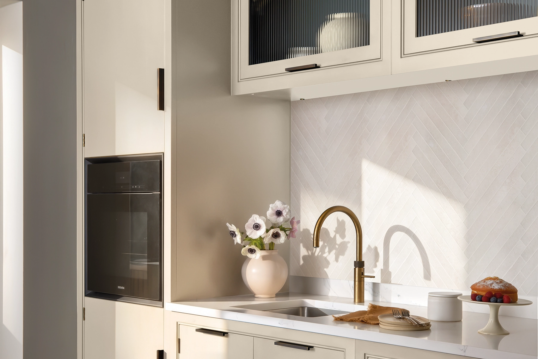 Contemporary modern neutral kitchen with Malone cabinetry in Burnet