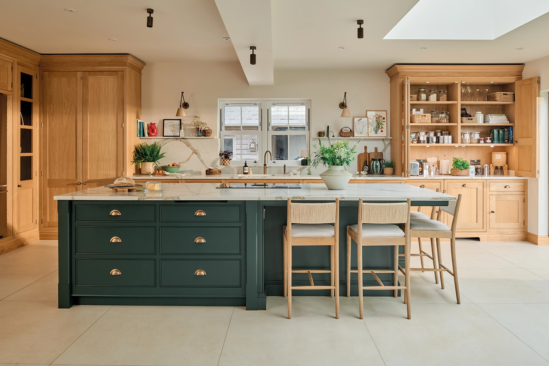 Oak family kitchen with natural oak cabinetry and deep green Avocado island