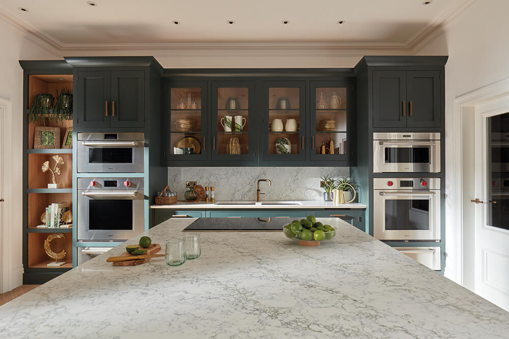 Deep green kitchen designed for entertaining. 