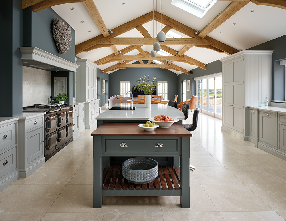 Grey fitted kitchen with central bespoke island. 