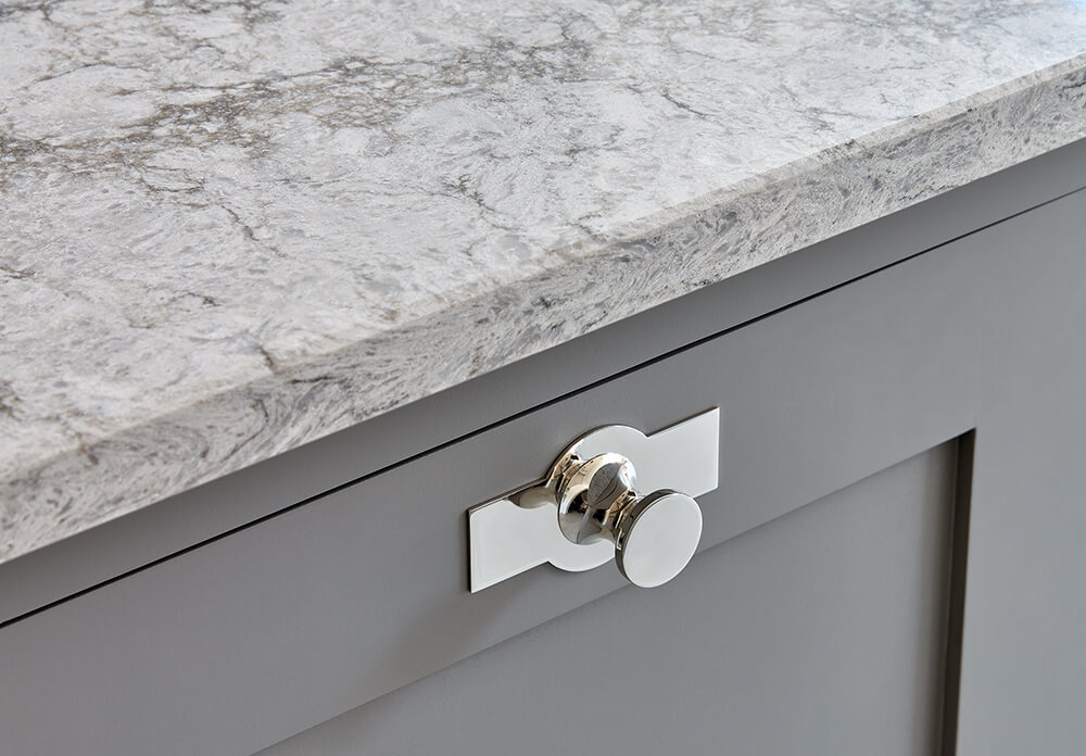 Grey kitchen with Caesarstone Moorland Fog worktop.