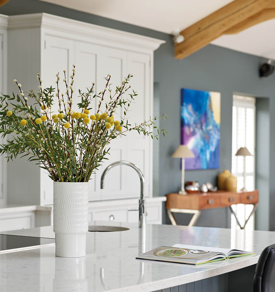 Colour in the kitchen with statement artwork.