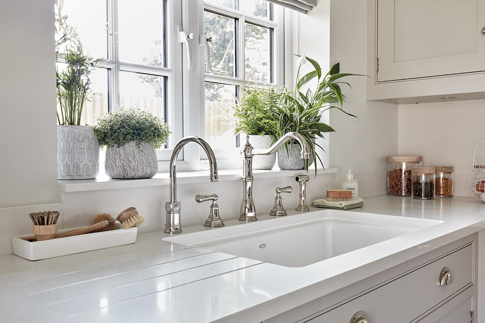 Traditional sink area with indoor plants to enhance wellbeing. 