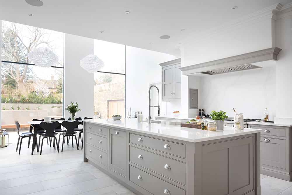 Open plan grey kitchen design. 