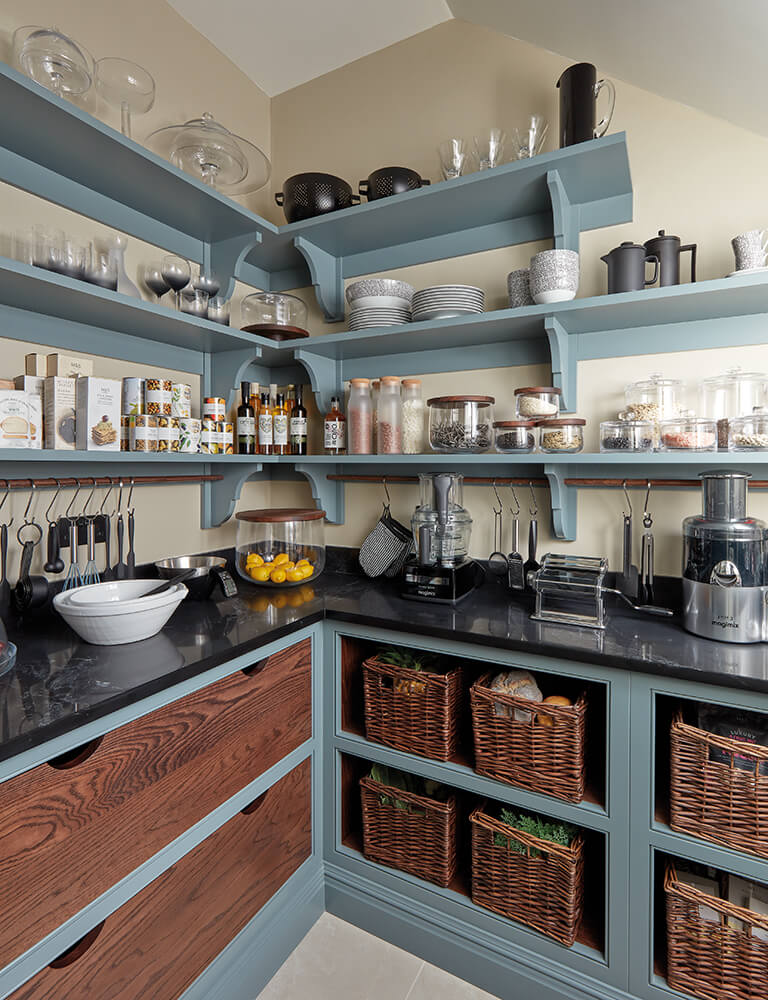 Blue walk in pantry with bespoke drawers and open shelving. 