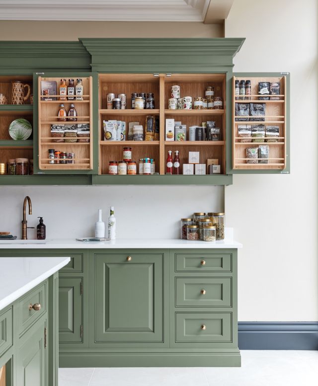 There are no hard and fast rules when it comes to planning kitchen storage, other than it should reflect your lifestyle and household needs.

This project has been designed with family mealtimes in mind. With bespoke door racks, spices, condiments, and even small containers of grains and pasta can be easily viewed before committing to a recipe.