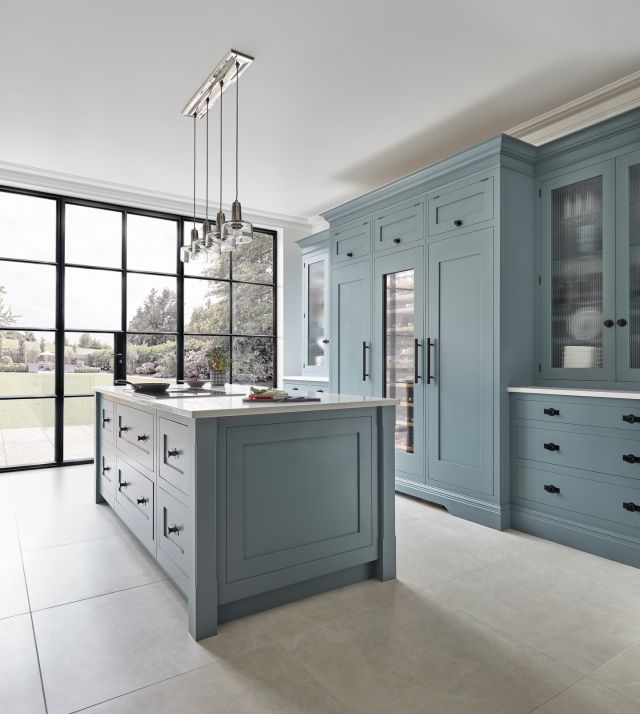 We're swooning over this view of our stunning Azurite Butler kitchen!

Azurite's captivating, down-to-earth hue offers an organic allure that feels fresh and inviting. This versatile shade plays beautifully with the calming neutrals in our palette, as seen here. Paired with Caesarstone Organic White worktops and the bold touch of matt black hardware, the result is a kitchen that exudes both serenity and striking visual impact.