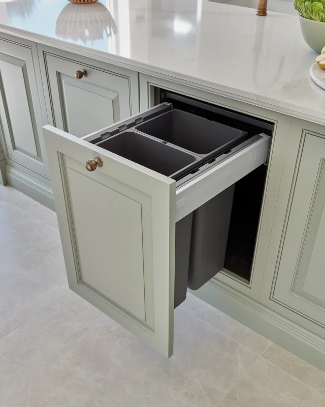 Keeping your kitchen’s clean aesthetic intact often comes down to how you manage waste and recycling. With hidden kitchen storage, even these practical necessities are handled with finesse. Pull-out recycling bins with divided compartments make it easy to sort waste efficiently. These space-saving systems can be concealed under the sink or within an island, keeping your kitchen pristine.

-

#tomhowley #kitchendesign #kitchenstorage #binstorage #kitchenorganisation #tidyhome #springclean #kitchenrecycling #kitchenstorageideas #homerenovation #greenkitchen
