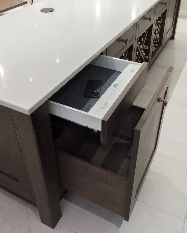 Smart storage, beautifully hidden.

A hidden safe drawer like this creates the perfect admin station. Think keys, phones, important documents, even medication, kept neatly out of sight and safely out of reach of little ones.

Creative Design Director, Tom Howley explains, "If you always drop essentials like your phone or keys in the kitchen, planning a dedicated space like this keeps your worktops clear and everything safely stored."

Discover more hidden storage ideas via the link in our bio.

-

#kitchendesign #tomhowley #smartstorage #hiddenstorage #kitchenorganisation #familykitchen #kitchentech #safedrawer #oakkitchen #darkoakinteriors