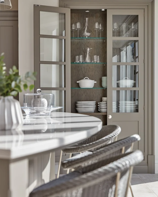 Glass-fronted cabinets offer a lighter, more refined alternative to solid doors, allowing you to keep your favourite pieces on display while protecting them from dust.

In our Hartford kitchen, a full-height glazed pantry ensures your most beautiful items are always visible and never tucked away. Discreet integrated lighting adds a soft, ambient glow, perfect for setting the mood during a cosy dinner or evening drinks with friends.

-

#tomhowley #kitchendesign #glazedcabinetry #glasscabinets #pantry #bespokekitchen #kitcheninspo #storageideas #kitchenstyling #interiordesigndetails #kitchenlighting #displaystorage