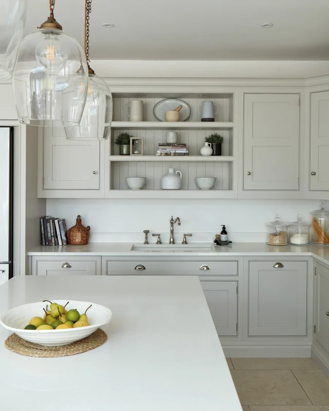 Open shelves are a chance to showcase the things you love: a collection of hand-thrown pottery, vintage glassware, or fresh herbs in pots. But it's all about editing, leaving space between items to keep things feeling light and intentional rather than cluttered.

What's your favourite thing to display on open shelves?

-

#tomhowley #kitchendesign #neutralhome #familykitchen #openshelving #neutralkitchen #kitchenideas #homerenovation #quietluxury