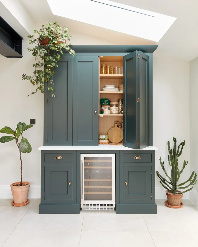 We’re revisiting a favourite from the archives, a striking Edwardian semi that underwent a significant transformation. After years of planning, the owners chose to open up their home with a generous side extension, placing a Tom Howley kitchen at its heart.

They chose our Kavanagh collection, a sleek Shaker style. At the centre, a generous island in Avocado with a Caesarstone Organic White work surface provides both function and personality, complete with intelligent storage, integrated appliances, and open shelving for personal touches.

Discover your perfect kitchen. Request a brochure via the link in our bio.

#tomhowley #kitchendesign #homestyle #greenkitchen #openplan #kitchenextension