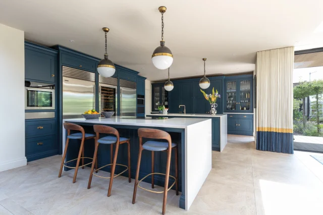 Helen knew from experience that a single long island worktop wouldn't work in a space this size. Instead, she and designer Julianne created a two-island layout, one for prep, one for cooking, that lets her move with ease and stay part of the conversation.

See more of Helen's kitchen and hear her design journey — link in bio.

#tomhowley #kitchendesign #bespokekitchen #kitchenisland #doubleisland #familykitchen #kitcheninspiration #craftsmanship