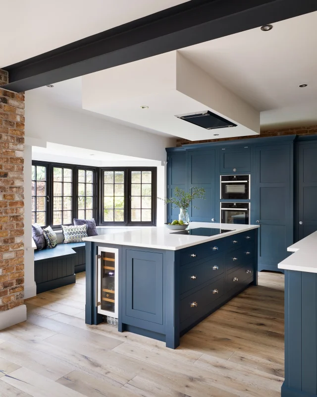 Not every kitchen is perfectly proportioned, but that doesn't mean it can't be both beautiful and highly functional. As our Creative Design Director, Tom Howley, explains in @livingetcofficial:

"Rather than fight architectural features like bay windows, thoughtful design works with them. Bespoke joinery is key, crafted to fit the space precisely and make every inch count."

This kitchen's bay window has been reimagined as a comfortable seating nook, where guests can gather or you can pause and enjoy the garden scenery.

Save this post for inspiration if you're looking to turn an unconventional layout into a kitchen that's practical and beautifully lived-in.