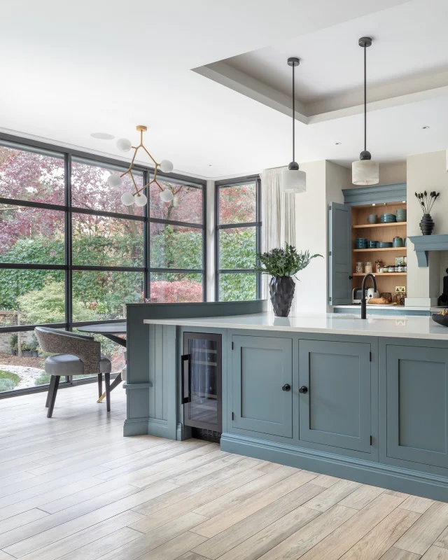 This rich blue kitchen has been designed around family life. A generous central island with integrated bench seating encourages informal breakfasts, homework sessions, and lazy weekend chats, while the thoughtfully planned breakfast pantries keep snacks and essentials within easy reach, whatever the time of day.

Industrial touches meet soft, welcoming tones, with natural light flooding through garden-facing Crittall doors, creating a space that feels both lively and calm. Every corner has been considered, from storage to seating so the kitchen works as hard as the family who lives in it, making it the true heart of the home.

Whether you’d like a home visit or prefer to meet in one of our beautiful showrooms, our expert designers are here to inspire, guide, and help bring your kitchen vision to life.

Request your design visit via the link in our bio.