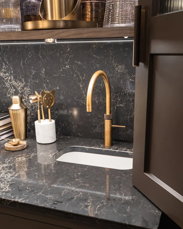 A curated mix of materials defines this home bar area: Caesarstone Vanilla Noir, burnished brass hardware, reeded backboards and Hazelwood cabinetry create a layered, quietly luxurious atmosphere.

Take a closer look at the bar and explore the full project on our blog.

-

#HomeEntertaining #HomeBar #TomHowley