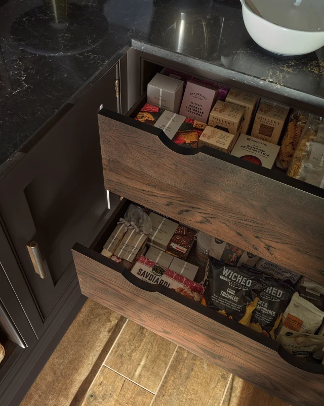 Don’t shy away from dark, moody tones in smaller rooms. A rich paint colour like Hazelwood softens the edges of the walls, creating a sense of depth and intimacy. Layer it with dark surfaces and the warm glow of burnished brass hardware, and you move away from sterile perfection toward a home that feels comfortably lived-in.

Want to see how this colour could work in your home? Request a design visit today via the link in our bio.

-

#tomhowley #moodyinteriors #interiordesignideas #pantrydesign #kitchendesign