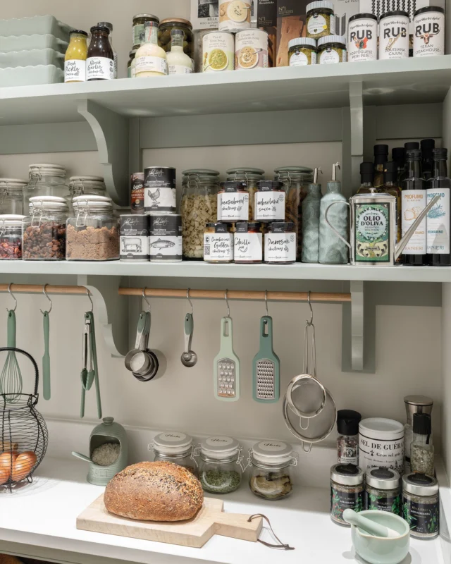 You have the layout, the storage, and the finishes. Now, it's time to organise the contents of your walk-in pantry.

- Zone it: Group similar everyday objects together in the easy-to-reach middle section of your pantry.
- Decant: Pour dried goods (pasta, grains, flour) into labelled glass containers. This removes bulky packaging, frees up room, and makes grabbing ingredients effortless.
- Resist over-stocking: Filling shelves to the brim makes it difficult to see what you have. Rotate older foods to the front so they are used before they expire.
- Light it right: These spaces often lack natural light. Motion-sensor LEDs beneath wall cabinetry or within open shelving are a hassle-free must.

Discover our walk-in pantry design ideas via the link in our bio.

#tomhowley #walkinpantry #pantryorganisation #homeorganisation #kitchendesign