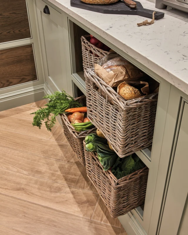 Bringing order to the busiest of environments.

As soon as you step foot into your walk-in pantry, you should be able to grab what you need with ease. This requires a masterful mix of intelligent storage solutions.

- Go vertical: Run shelves or cabinets all the way to the ceiling to maximise every square inch.
- Vary your depths: Use shallow shelves for spices and cereals, and sturdy oak shelving for heavy jars.
- Utilise the underside: Install rails beneath floating shelves to hang favourite utensils, freeing up valuable drawer space.
- Pull-out access: Deep drawers and wicker baskets are essential for storing fresh produce (onions, potatoes) and baking goods that need to be kept cool and dry.

#tomhowley #walkinpantry #pantrygoals #kitchendesign #homestorage