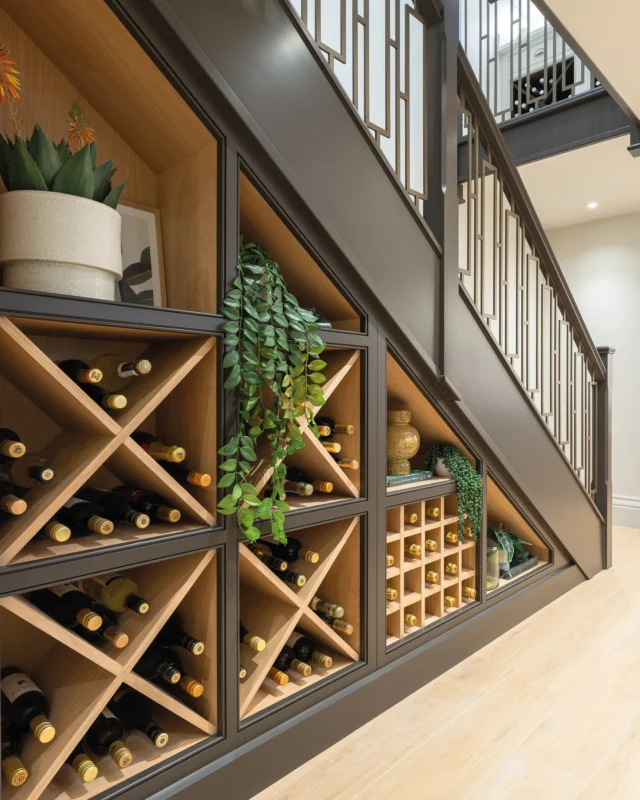 The space under the stairs is often forgotten about. But with a little imagination, it can become something special.

This bespoke wine display combines our Hazelwood cabinetry with natural oak interiors, dedicated bottle storage and custom shelving.

#tomhowley #winestorage #understairsstorage #bespokecabinetry #luxuryhomes