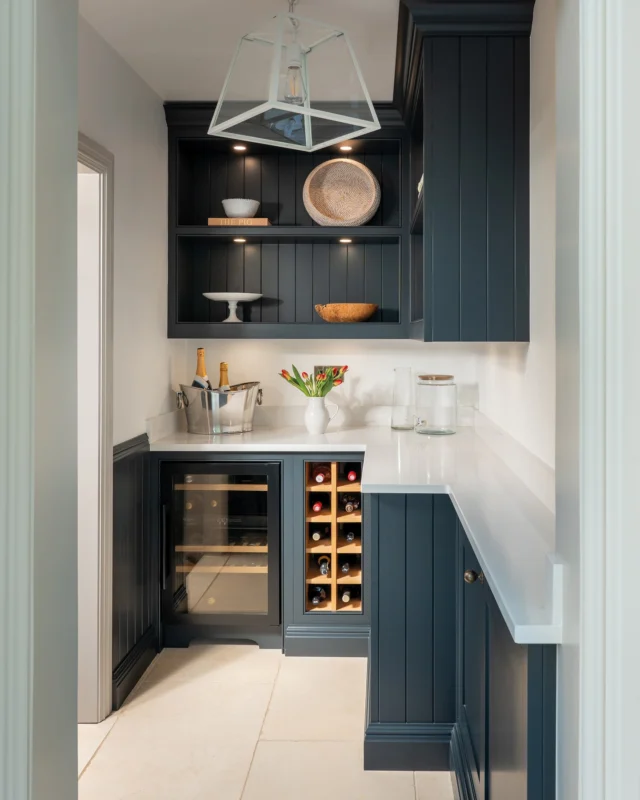 Every kitchen needs somewhere for the bits and bobs that don't quite have a home in the main space. At @thecottageonthecanal, that's exactly what this pantry does.

Finished in the same Nightshade as the kitchen island, it creates a natural flow between the two spaces, a small detail that ties the whole house together.

The priority here was simple: create a kitchen that works around how the family actually lives. Extra worktop space gives them room to prep, serve and spread out when the kitchen is busy, whether that’s during a family gathering or just a full house at dinner time. And with wine storage tucked neatly away, everything is close to hand without adding clutter to the main kitchen.

Learn how this space came together via the link in our bio.

@thecottageonthecanal
@davidgilesphotography

#tomhowley #pantrygoals #kitchendesign #cottagekitchen #storageideas